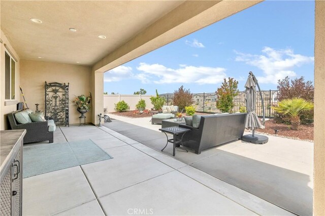 view of patio / terrace with a fenced backyard and an outdoor living space