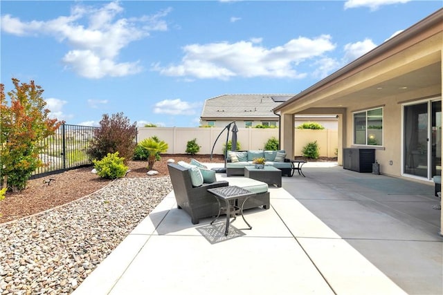 view of patio with a fenced backyard and outdoor lounge area