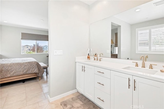 32148 Sedge Way, Temecula, CA 92591 - ensuite bathroom with double vanity, tile patterned flooring, baseboards, and recessed lighting