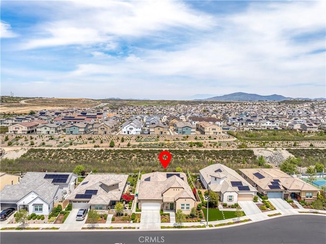 birds eye view of property featuring a residential view and a mountain view
