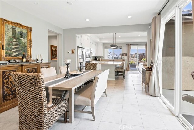 dining space with recessed lighting and light tile patterned flooring