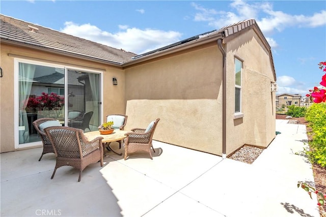 view of patio featuring fence