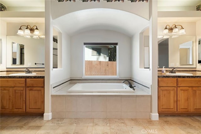 14124 Rollins Ct, Magalia, CA 95954 - full bath featuring a notable chandelier, a sink, and a bath