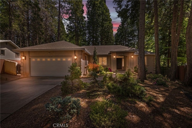 14124 Rollins Ct, Magalia, CA 95954 - view of front of property with an attached garage, driveway, and stucco siding