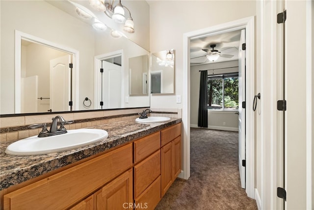 14124 Rollins Ct, Magalia, CA 95954 - full bath with double vanity, a sink, baseboards, and a ceiling fan