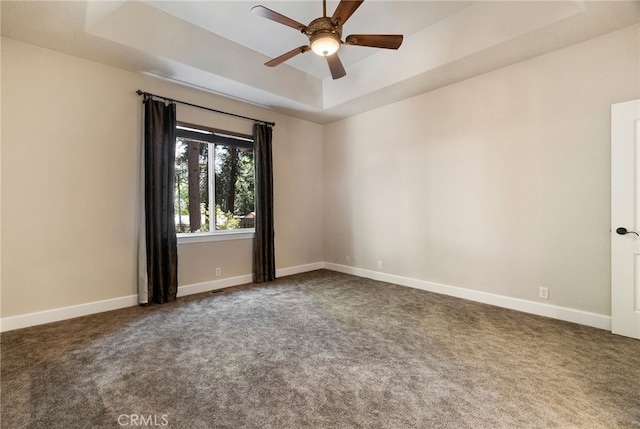 14124 Rollins Ct, Magalia, CA 95954 - spare room with carpet flooring, a tray ceiling, and ceiling fan