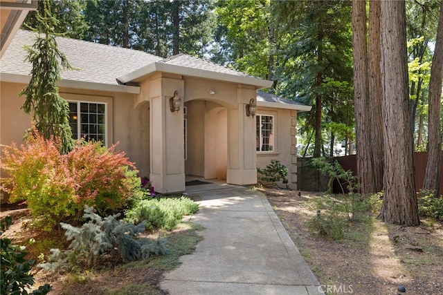 14124 Rollins Ct, Magalia, CA 95954 - property entrance featuring stucco siding, a shingled roof, and fence