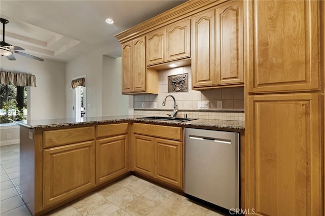 14124 Rollins Ct, Magalia, CA 95954 - kitchen featuring decorative backsplash, a peninsula, dark stone counters, a sink, and dishwasher