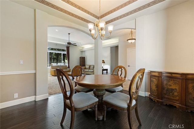 14124 Rollins Ct, Magalia, CA 95954 - dining space with baseboards, ceiling fan with notable chandelier, arched walkways, and dark wood-type flooring