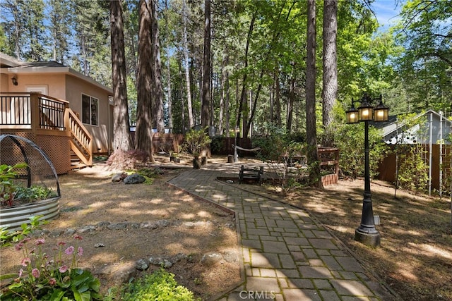 14124 Rollins Ct, Magalia, CA 95954 - view of yard with stairway, a deck, a patio, and a fenced backyard
