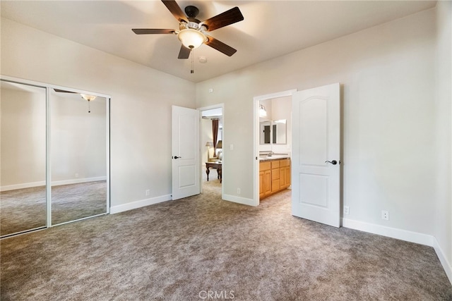14124 Rollins Ct, Magalia, CA 95954 - unfurnished bedroom featuring baseboards, ceiling fan, a closet, and light colored carpet