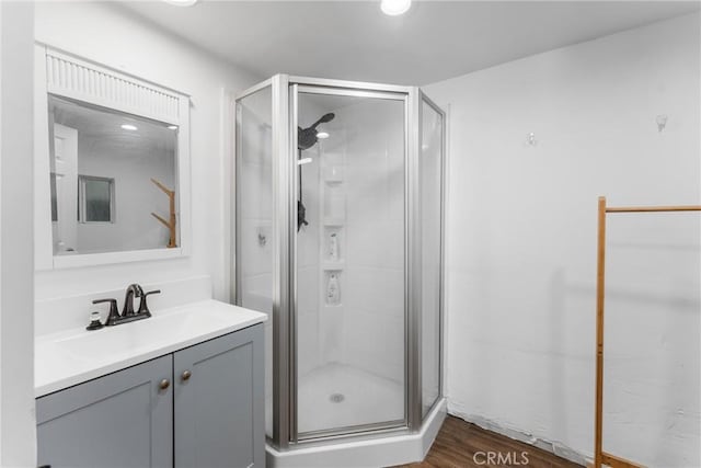 31869 Florida St, Redlands, CA 93373 - full bathroom featuring a stall shower, vanity, and wood finished floors