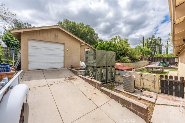 31869 Florida St, Redlands, CA 93373 - detached garage featuring central AC, driveway, and fence