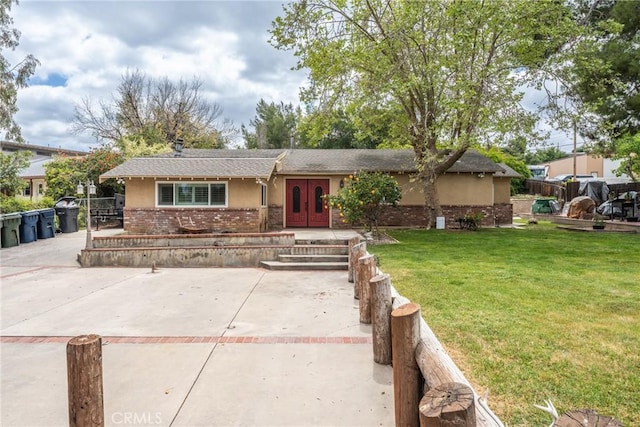 31869 Florida St, Redlands, CA 93373 - single story home with french doors, brick siding, stucco siding, a front lawn, and a shingled roof