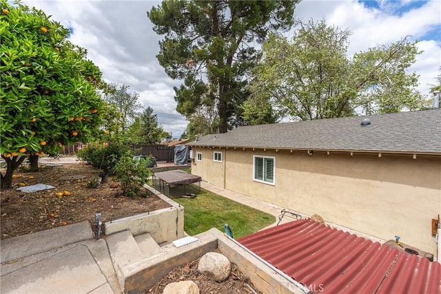 31869 Florida St, Redlands, CA 93373 - exterior space with fence, a shingled roof, and stucco siding