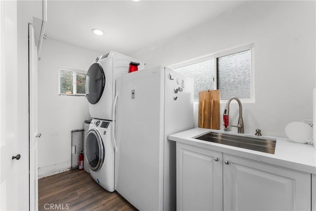 31869 Florida St, Redlands, CA 93373 - laundry area with dark wood-style flooring, recessed lighting, stacked washer / drying machine, and a sink