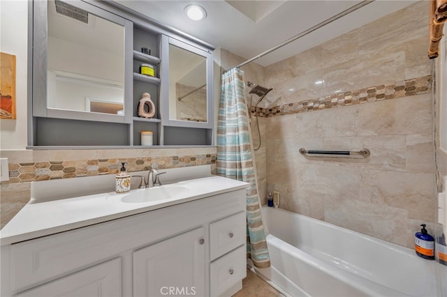 full bath with vanity, backsplash, shower / bath combo, and visible vents