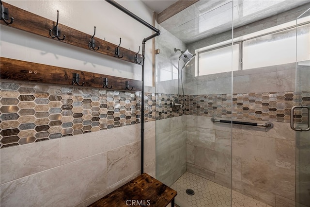 full bath with a shower stall