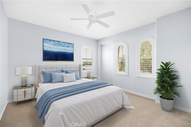 bedroom featuring carpet floors, baseboards, and ceiling fan