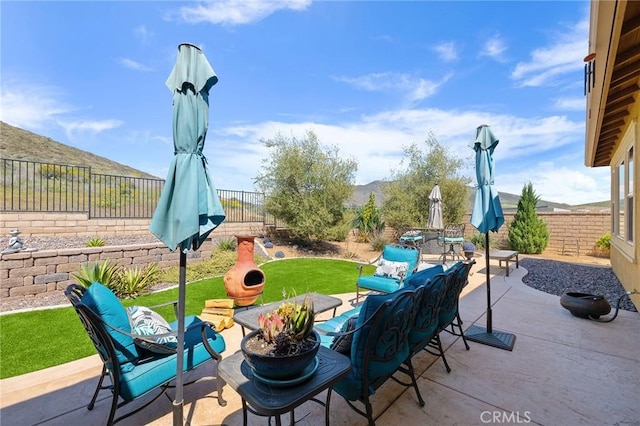 view of patio featuring a fenced backyard and an outdoor hangout area