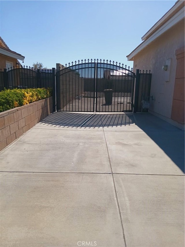 view of gate with fence