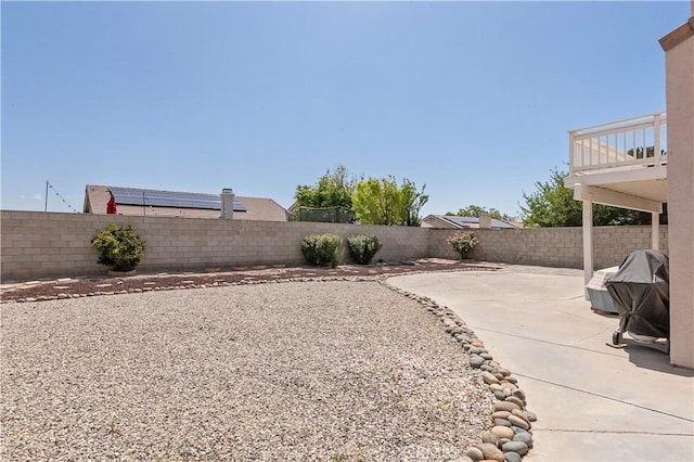 view of yard with a fenced backyard and a patio area