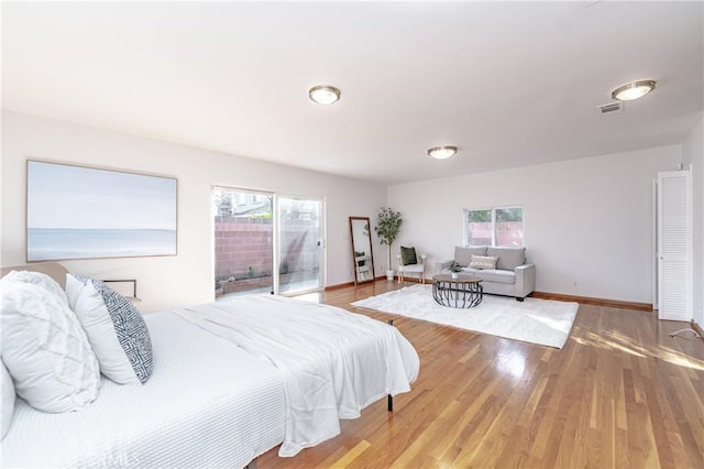2750 Fanwood Ave, Long Beach, CA 90815 - bedroom with access to exterior and wood finished floors