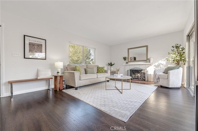 2750 Fanwood Ave, Long Beach, CA 90815 - living room with dark wood-type flooring and a fireplace