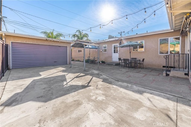 2750 Fanwood Ave, Long Beach, CA 90815 - view of patio / terrace featuring an outbuilding and a garage