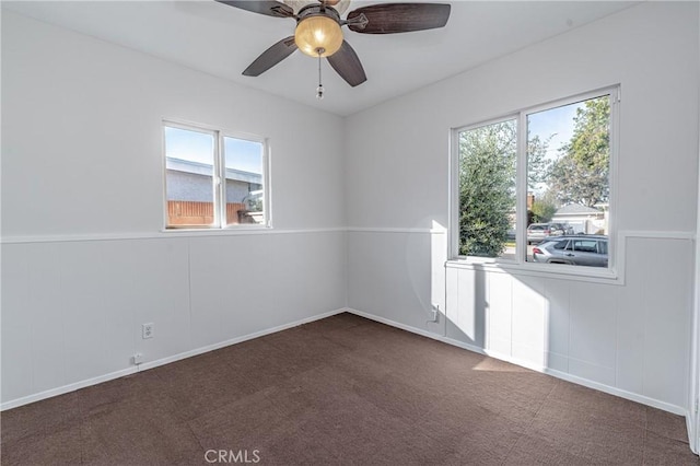 2750 Fanwood Ave, Long Beach, CA 90815 - unfurnished room featuring healthy amount of natural light, carpet, a ceiling fan, a decorative wall, and a wainscoted wall