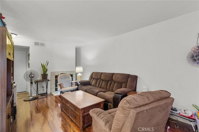living room featuring wood finished floors and visible vents