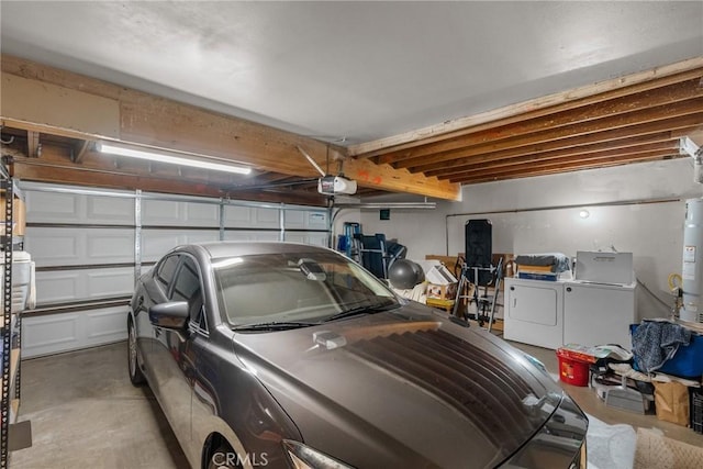 garage with secured water heater, a garage door opener, and washing machine and dryer