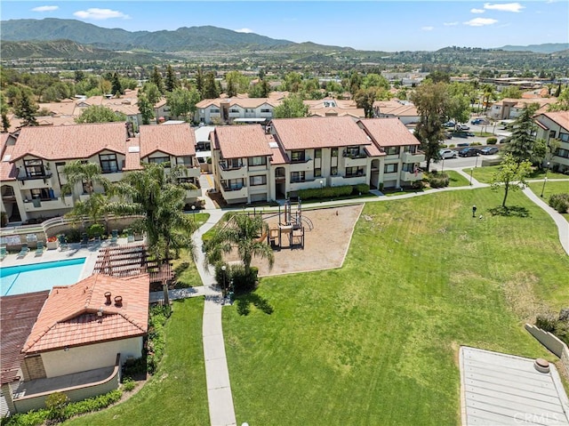 drone / aerial view featuring a mountain view and a residential view