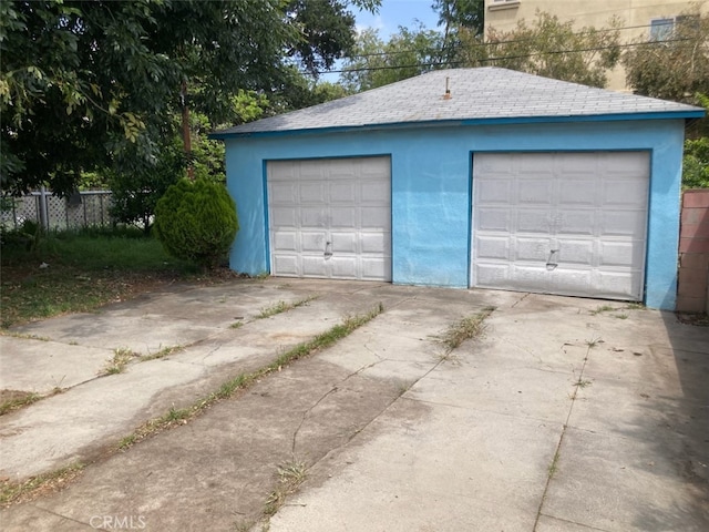 detached garage with fence