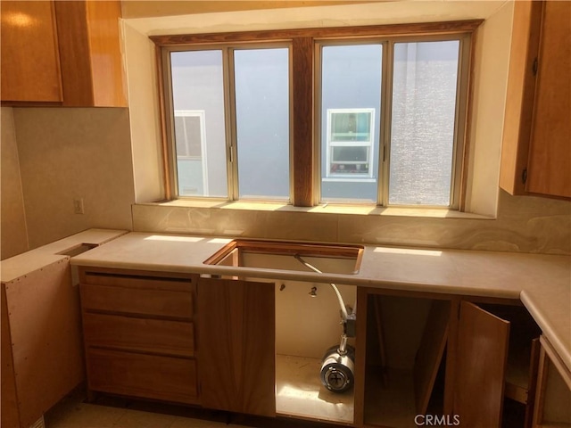 kitchen with light countertops and a sink