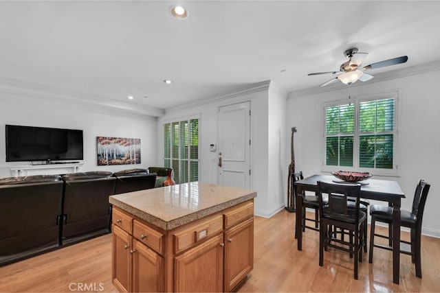 7132 Farralone Ave Unit 203, Canoga Park, CA 91303 - kitchen featuring crown molding, recessed lighting, ceiling fan, and light wood-style flooring