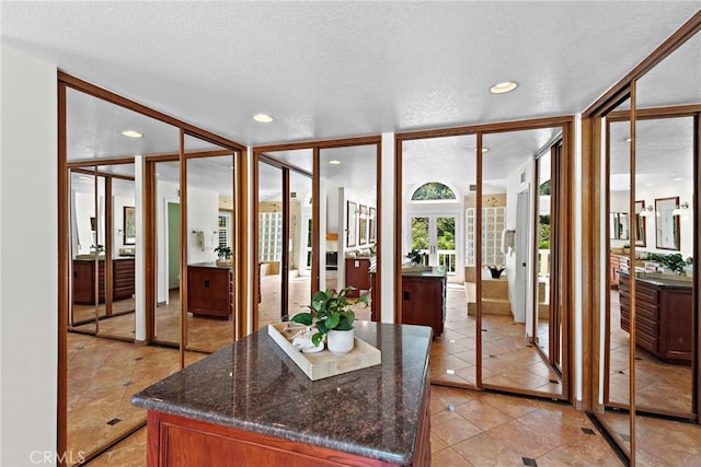 25122 Black Horse Ln, Laguna Hills, CA 92653 - interior space featuring a textured ceiling, vanity, and recessed lighting