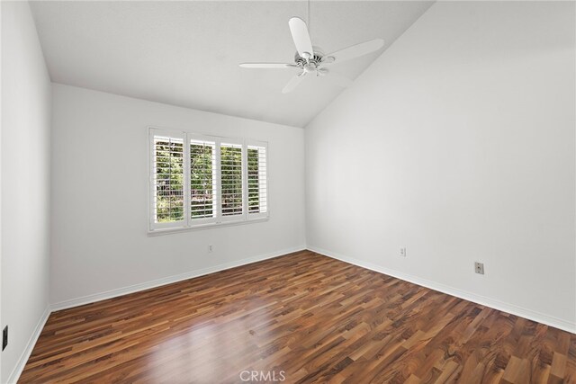 unfurnished room with wood finished floors, lofted ceiling, a ceiling fan, and baseboards