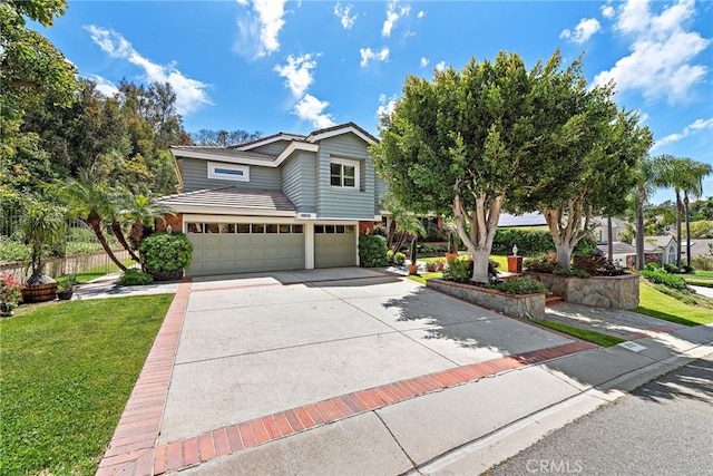 25122 Black Horse Ln, Laguna Hills, CA 92653 - view of front of property with driveway, an attached garage, fence, and a front yard