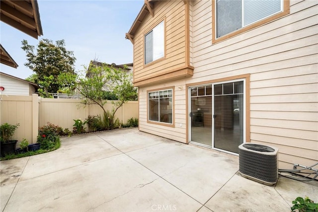 view of patio / terrace with fence and central AC unit