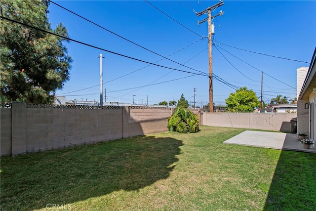 view of yard featuring a patio and a fenced backyard