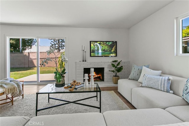 living area featuring wood finished floors and a fireplace