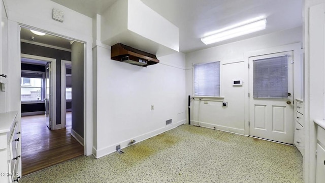 washroom featuring baseboards and visible vents