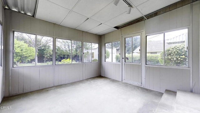 unfurnished sunroom with a healthy amount of sunlight