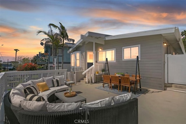 33935 Violet Lantern St, Dana Point, CA 92629 - back of house at dusk featuring a patio, outdoor lounge area, and entry steps