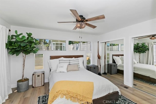 33935 Violet Lantern St, Dana Point, CA 92629 - bedroom with light wood finished floors, multiple closets, multiple windows, and ceiling fan