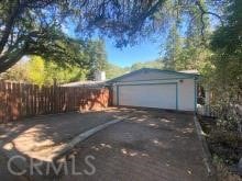 garage with aphalt driveway