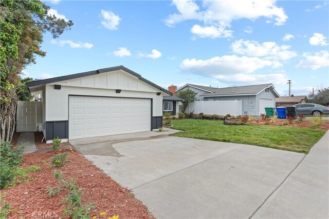 single story home with a garage, a front lawn, fence, board and batten siding, and driveway