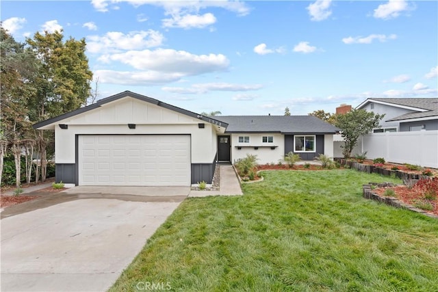 ranch-style home with fence, an attached garage, driveway, and a front lawn