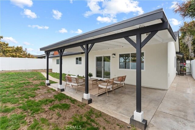 view of patio / terrace featuring an outdoor hangout area and fence